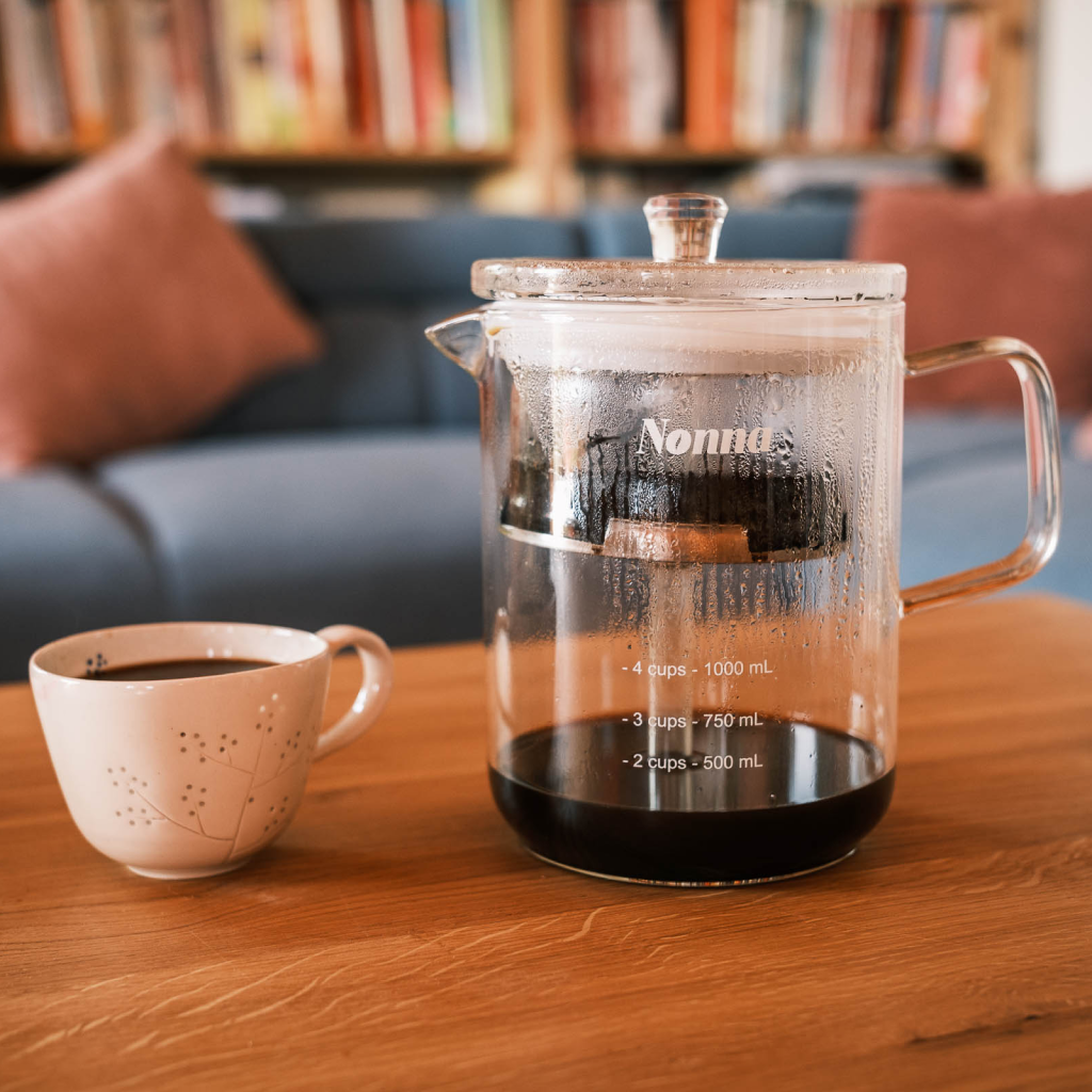Enjoying a cup of bold coffee from a plastic free coffee maker called the NONNA.